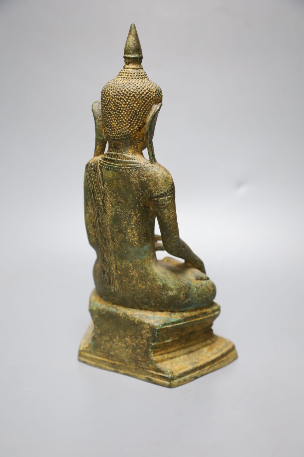 An 18th century Burmese Buddha, with traces of original gilding on bronze, height 27cm